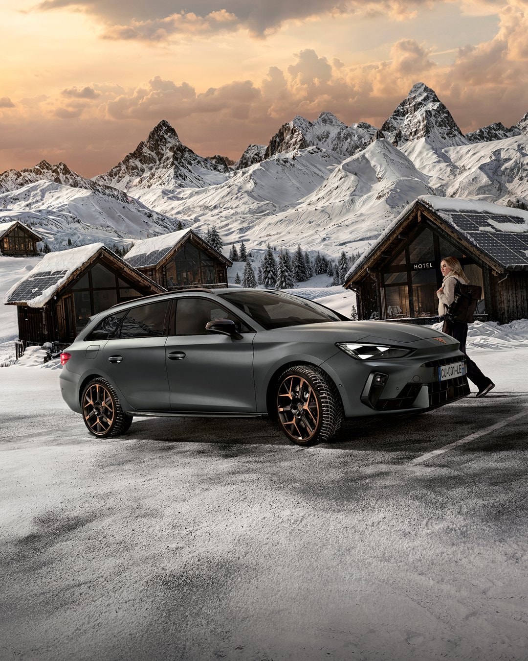 woman using my cupra app on phone during the night for remote monitoring of plug-in hybrid electric vehicle