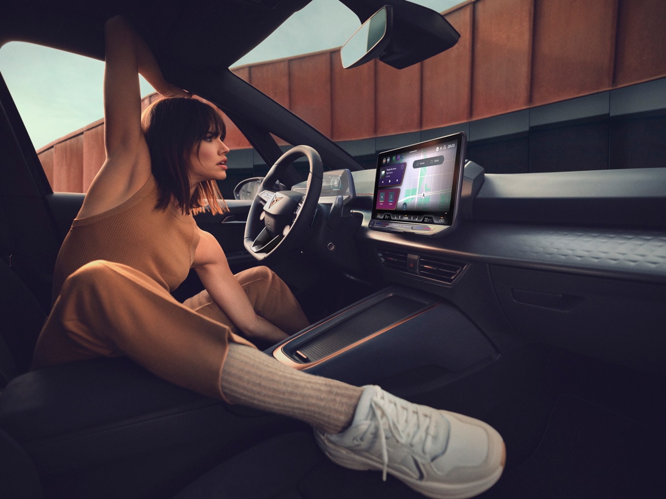 cupra formentor and man wating to received roadside assistance for electric and hybrid cars