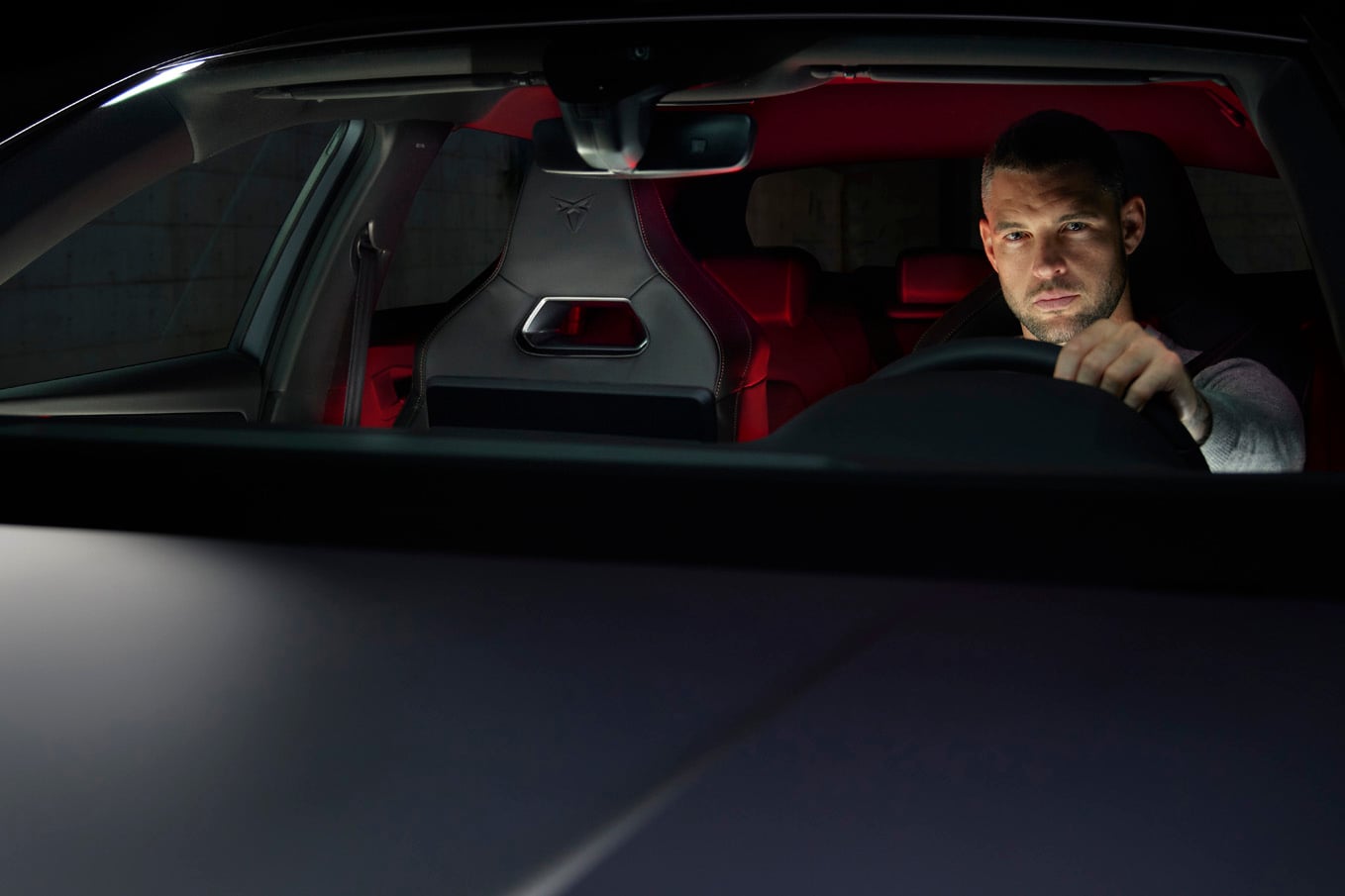 dark forest cupra born electric vehicle in motion