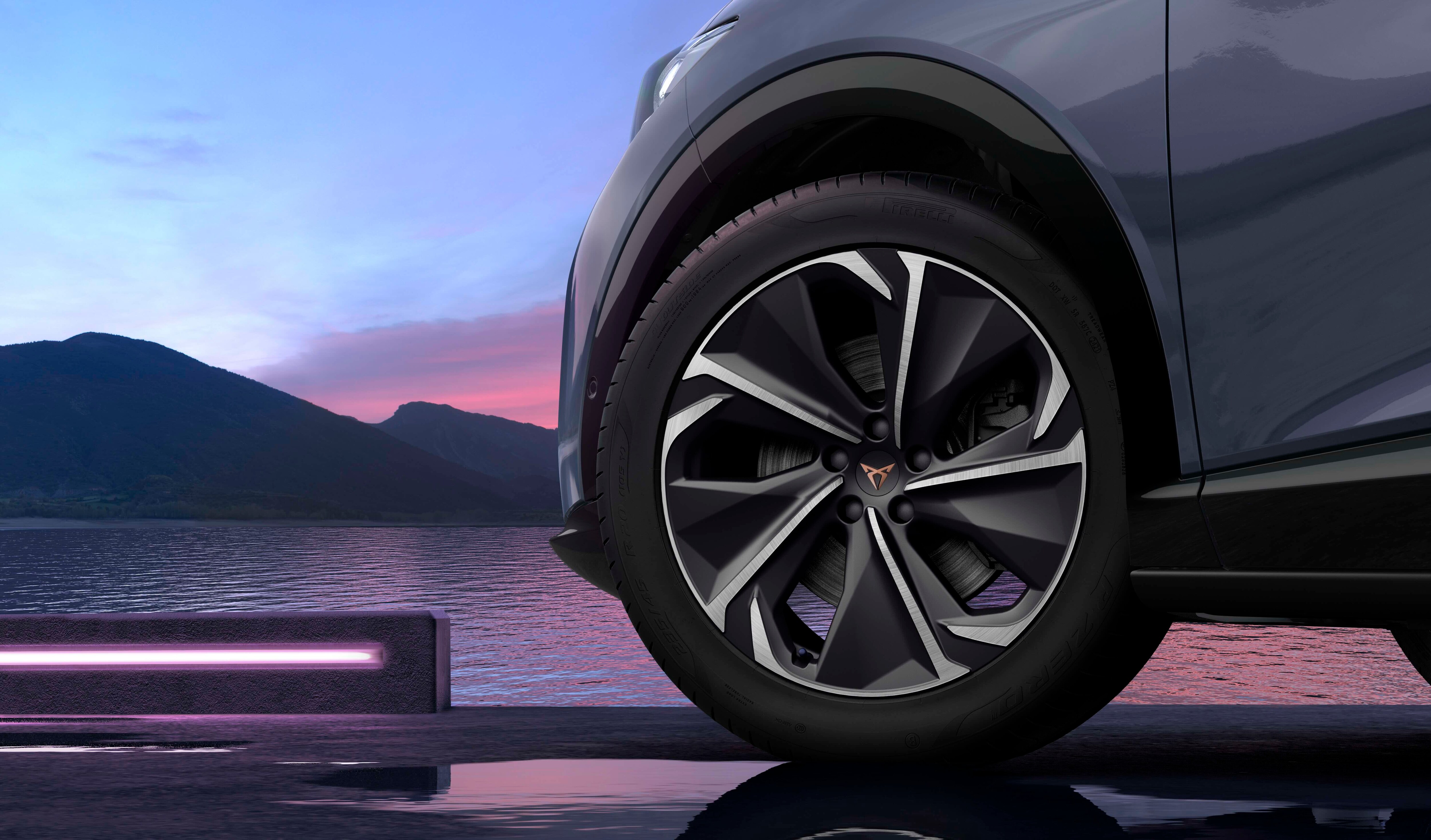 phev cupra leon sportstourer in motion, urban setting at sunset
