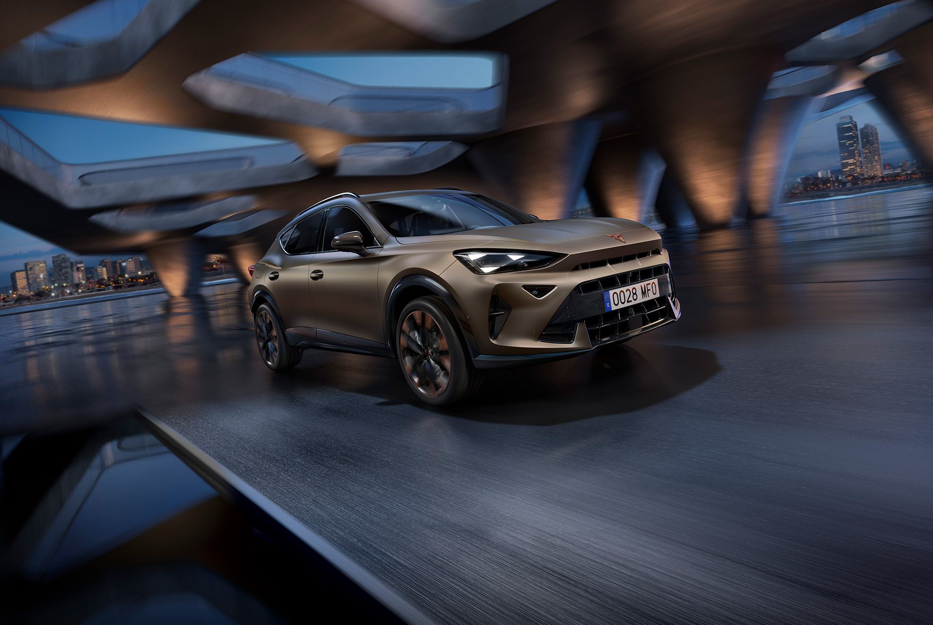 A three quarter front view of the new CUPRA Formentor 2024 car in motion, in the century bronze matt colour, with a blurred background.