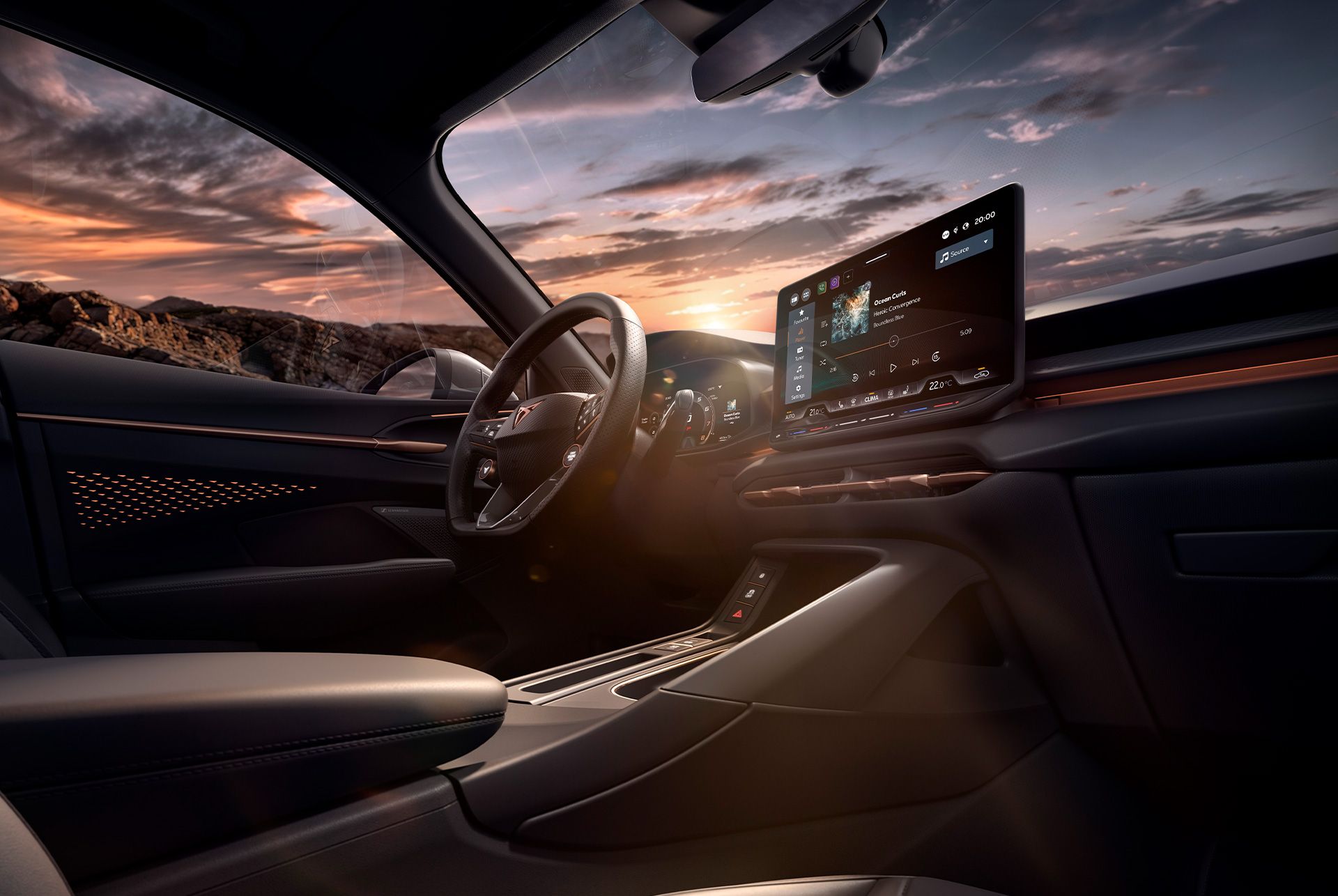 intérieur du nouveau cupra terramar vz high canyon comprenant un système d’infotainment de 12,9 pouces, un tableau de bord, un volant avec palettes de changement de vitesse, des touches et une fonction de chauffage.