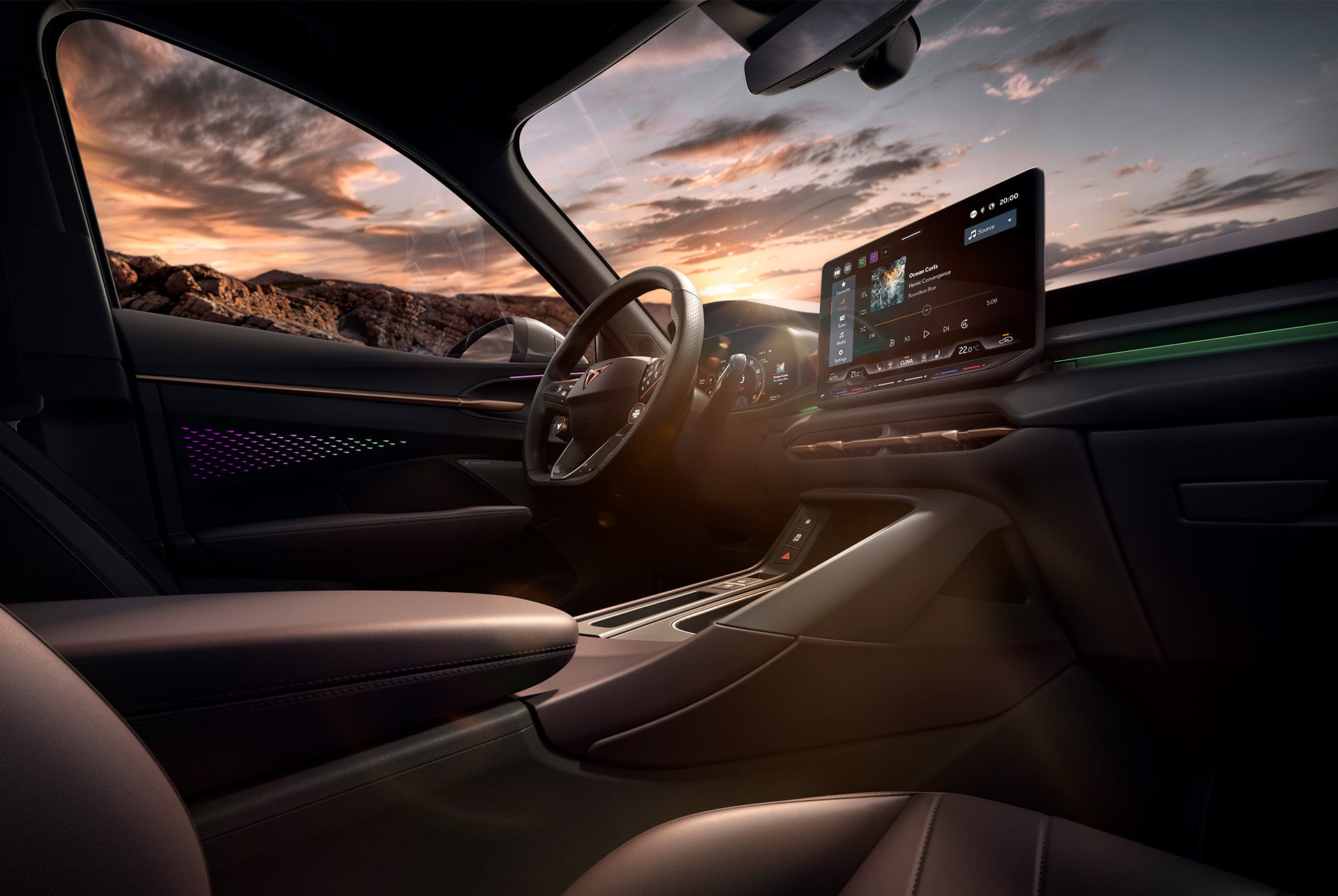 technologie intérieure du nouveau CUPRA Terramar 2025 avec système d’infotainment de 12,9 pouces, volant chauffant avec touches satellites et console centrale. Vue du tableau de bord. 