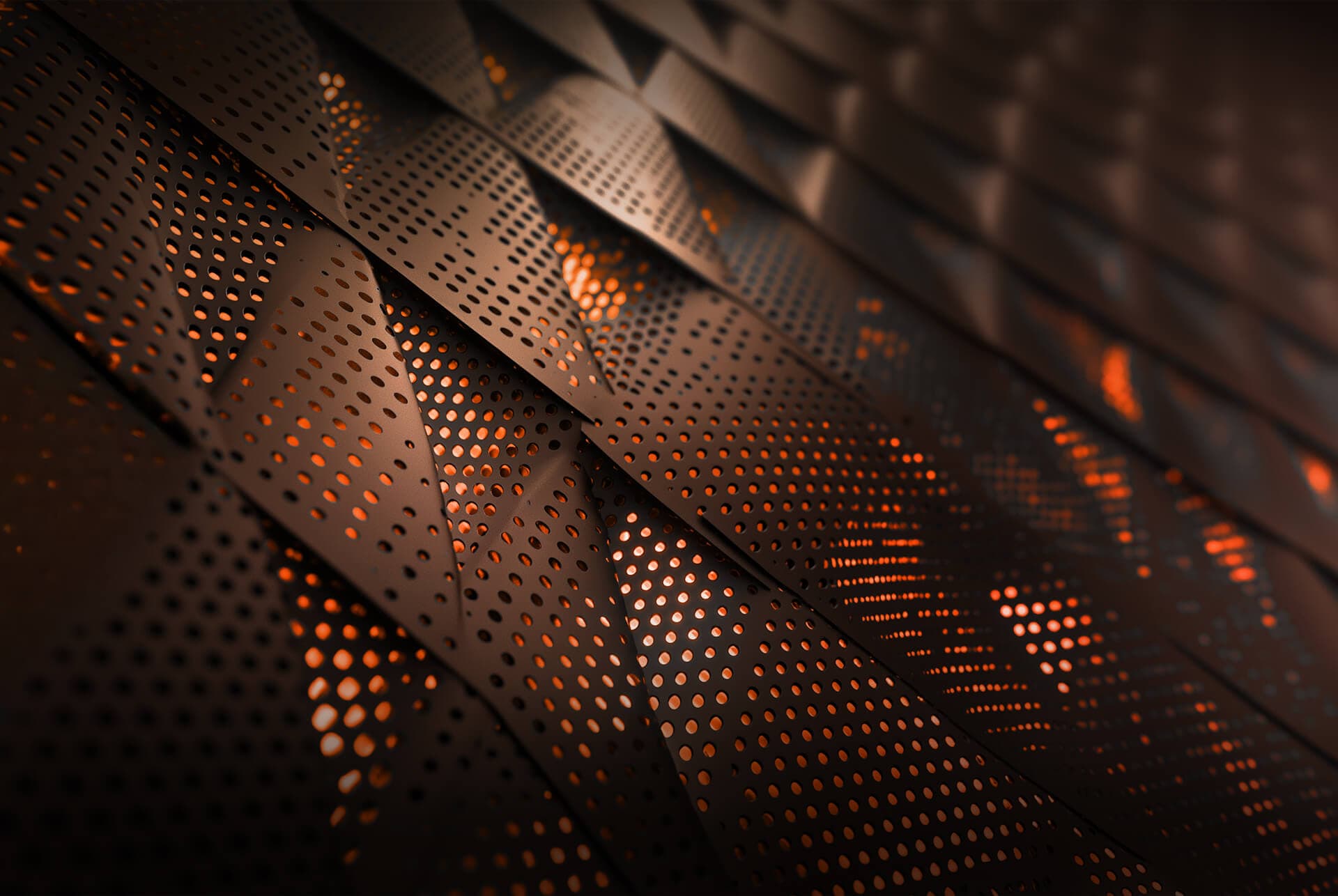 Gros plan de panneaux métalliques perforés avec une lumière orange qui brille à travers les trous. 